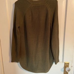 An olive green sweater from Stitch Fix. Only worn once, falls at the hips.
